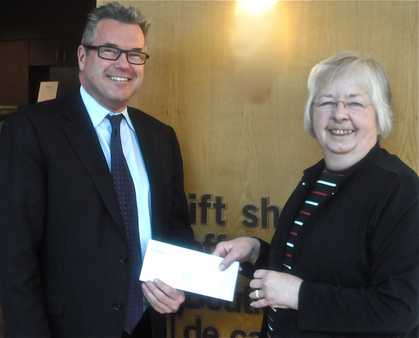 Auxiliary President Bev Carson presents a cheque for $50,000 to KDH CEO Colin Goodfellow