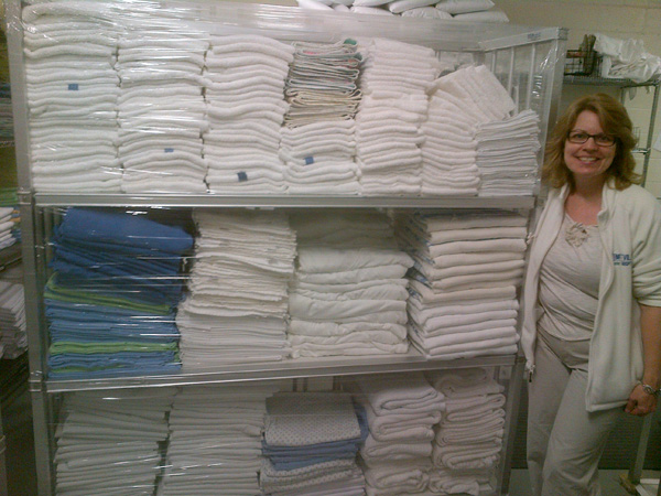 Kemptville Hospital Laundry-Housekeeping Technician Shelley Molson with a Hart Laundry general linen cart