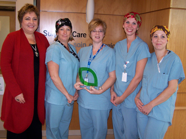 Surgical team with Booth award) Caption: KDH Surgical Care Unit staff holding the Booth Centennial Green Award. Left to right: Cathy Watson, Debbie Thurler, Julie Summers, Lindsay Essar, Joanne Rheaume